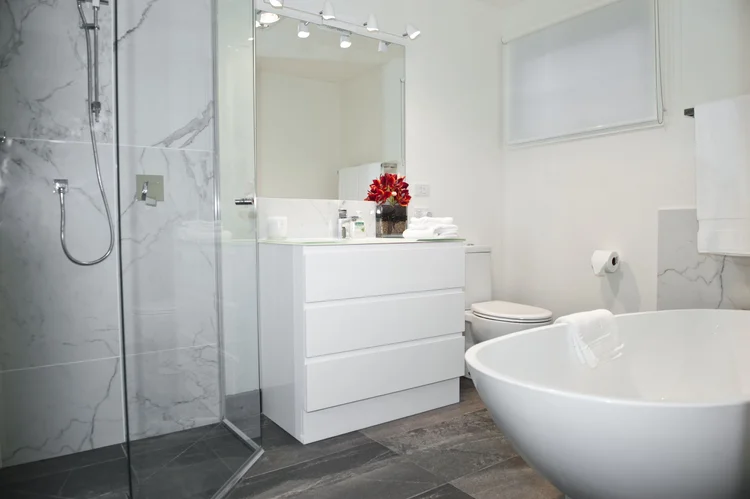 Villa ensuite bathroom with deep bath and large shower recess